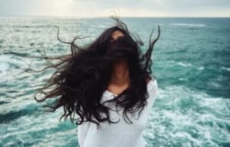 woman in front of the ocean