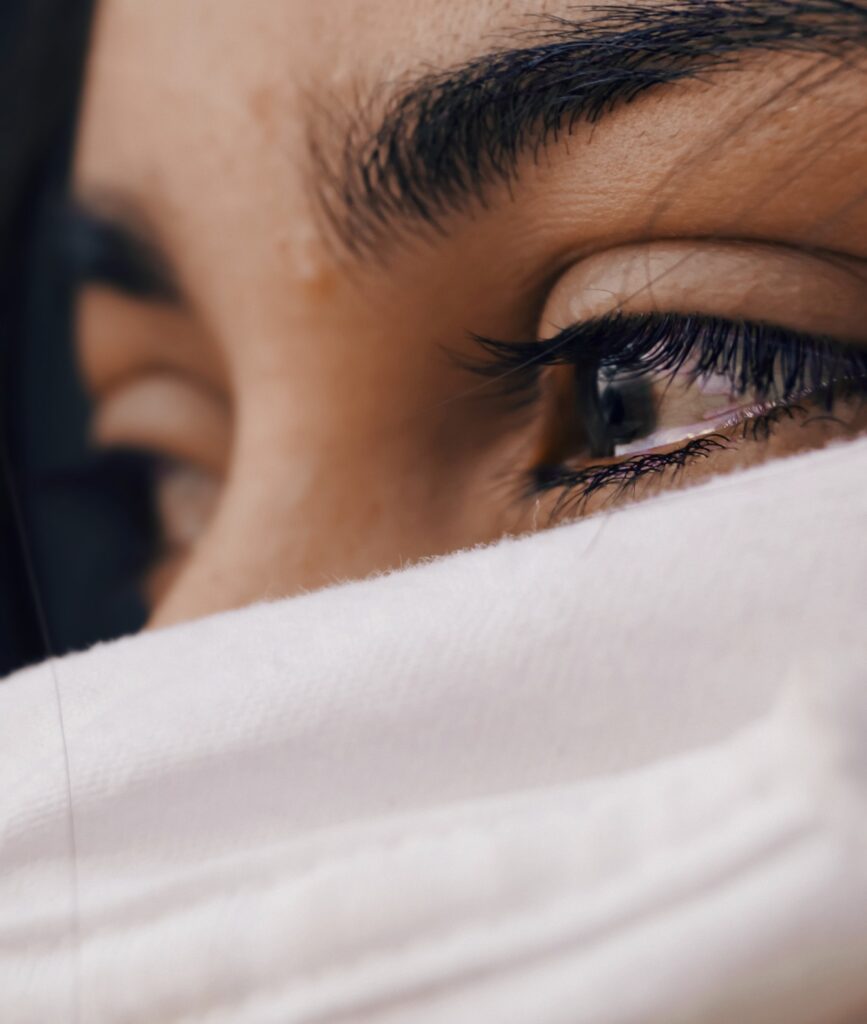 crying woman with white scarf