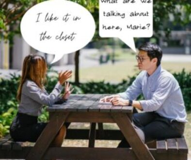 man and woman talking at a picnic table